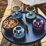 Glow 10 Candle Holder - on an outdoor tray table