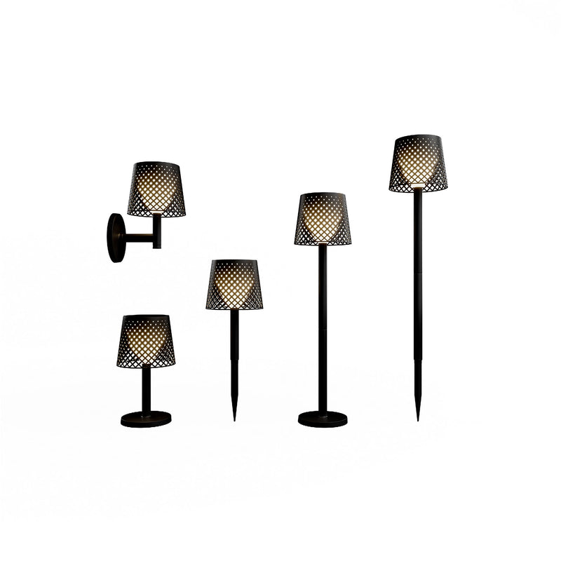 Black lattice-patterned shade glowing warm white, shown as wall, table, stake and floor versions — Greta Battery Lamp by New Garden