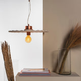 Guanabara Pendant Light by Geo Contemporary in White with copper fittings above a styled console with dried grasses