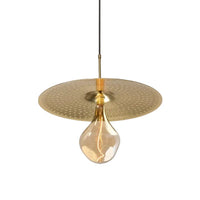 Ico Pendant Light by Cerno in spun solid brass, shown with a round Edison bulb