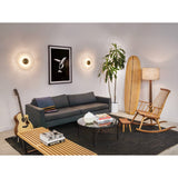 Inviso Wall Sconces by Cerno above a sofa in a living room