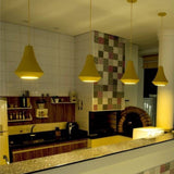 Juá Ceramic Pendant Light by Geo Contemporary in Yellow, four pendants glowing over a tiled kitchen counter