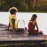 Lite-Up Play JBL Battery Table Lamp - Earth, on a lakeside jetty