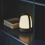 Lite-Up 2.0 Battery Table Lamp - Earth, lit on a dark shelf