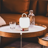 Loome Battery Table Lamp - Cloudy White, on a side table