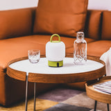 Loome Battery Table Lamp - Moss, on a side table