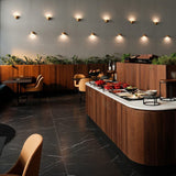 Matte Gold Enoki Wall Sconce by Penta in Dining Area