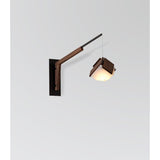 Motus Swing Arm Bracket by Cerno in textured black with walnut body, shown with a Mica pendant (sold separately)