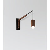 Motus Swing Arm Bracket by Cerno in textured black with walnut body, shown with a Cano pendant (sold separately)