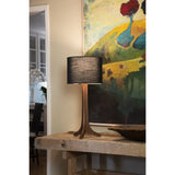 Nauta Table Lamp by Cerno in walnut with a Black Amaretto shade on a rustic console table