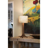 Nauta Table Lamp by Cerno in walnut with a Burlap shade on a rustic console table
