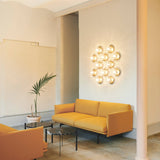 Nordic Gold/Optic Clear Liila 12 Wall/Ceiling Light by Nuura in Living Room