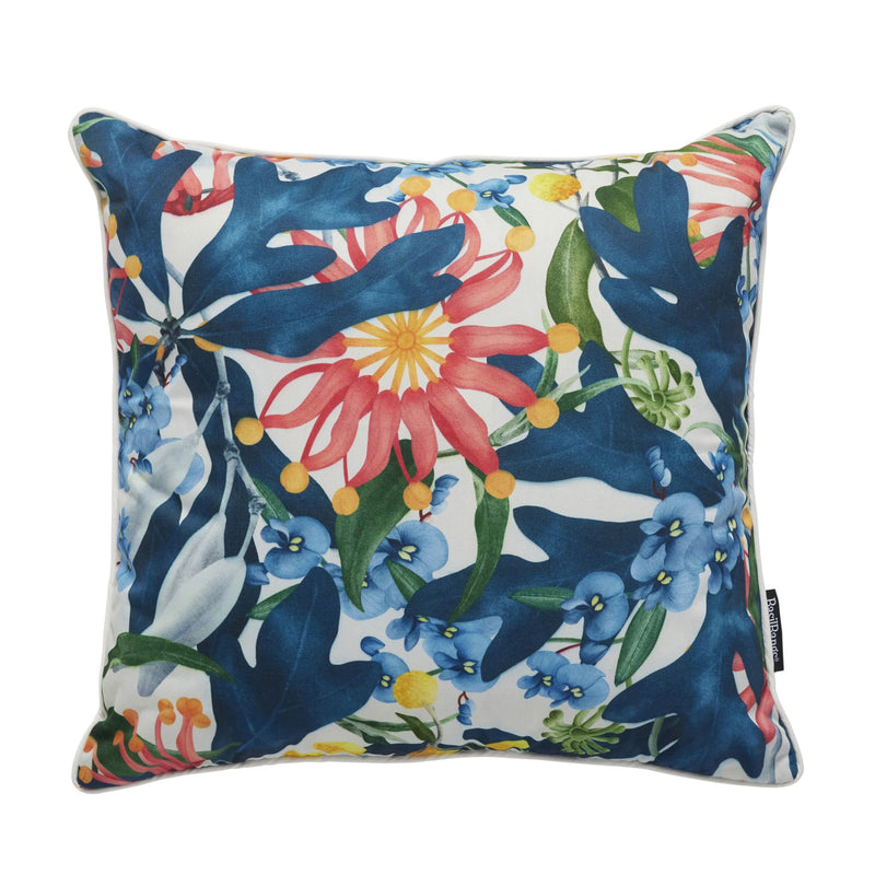 Square piped cushion in a bright botanical print of coral flowers, blue blooms and navy leaves on white — Throw Cushion 50x50cm by Basil Bangs