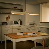 Oatmeal Flo PL2 Linear Suspension by Seed Design in Dining Area