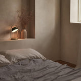 Olive Green Olo Ring Portable Table Lamp by Seed Design in Bedroom