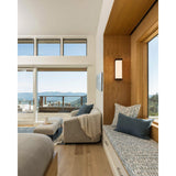 Ora Wall Sconce by Cerno in a bedroom window nook