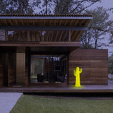 Pancho Floor Lamp - Lime With Cable, outside a cabin