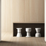 Pa.He.Ko Side Table - white on a wooden shelf