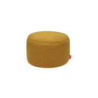 Round ochre-yellow ottoman upholstered in soft fleecy sherpa fabric with a small red Fatboy tab — Point Large Sherpa Ottoman & Footrest by Fatboy