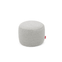 Round low pouf in light grey woven olefin fabric with a red brand tab — Point Olefin Ottoman & Footrest by Fatboy