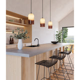Pharos Pendant Lights by Cerno lifestyle - three ivory and tea glass pendants over a kitchen island