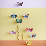 Ruby Dragonfly Wall Art, styled in an interior