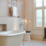 Raw Brass Begawan Round Brass Outdoor Wall Light by Mullan Lighting in Bathroom