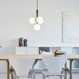 Rock Grey/Opal Miira 4 Pendant Light by Nuura in Dining Area
