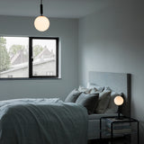 Rock Grey/Opal Miira Wall Sconce by Nuura in Bedroom