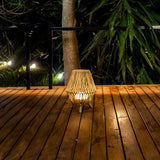 Sisine Table Lamp - lit on a deck