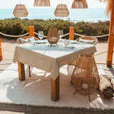 Sisine Floor Lamp - beside a beach dining table