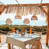 Sisine Portable Pendant Light - over a beach dining table