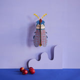 Striped Wing Beetle Wall Art, styled in an interior