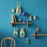 Striped Wing Beetle Wall Art, styled in an interior