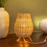 Saona Table Lamp - Indoor Only, lit on a sideboard