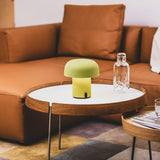 Sensa Battery Table Lamp - Moss, on a side table