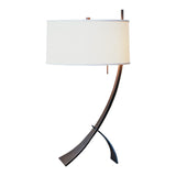 Stasis Table Lamp, shown in Bronze, Natural Anna Shade, by Hubbardton Forge