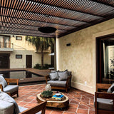 Sunset Ceramic Pendant Light by Geo Contemporary hanging over a lounge on a covered courtyard terrace