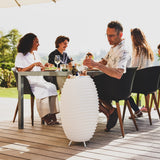 Synergy Battery Wine Cooler Lamp - Large, at an outdoor dinner