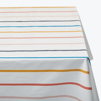 Cotton tablecloth in horizontal multicolour stripes of blue, red, mustard and grey on white — Basil Bangs Tablecloth by Basil Bangs