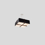 Veram Pendant Light by Cerno, 18 inch, walnut wood frame with matte black with matte white interior shade - angled view