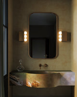 Vintage Brass 12inch Sinclair Wall/Vanity Light by Alora Lighting in Bathroom