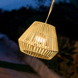 Conta Portable Pendant Light - Taupe, lit at dusk