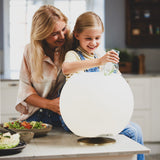 Sphere Battery Wine Cooler Lamp - Brass, on a kitchen island
