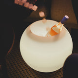 Sphere Battery Wine Cooler Lamp - lit with a bottle on ice