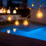 Stella Solar String Lights - by a pool at dusk