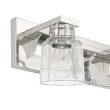 Dryden 24-inch 3-light Polished Nickel Vanity Light with Clear Ribbed Glass Shades