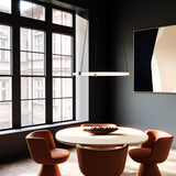 Bruni Pendant Light by Kuzco - Brushed Gold, Hanging above on round table