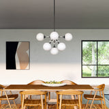 Celia Chandelier by Alora Mood - Large, Matte Black/Opal Glass above on the table