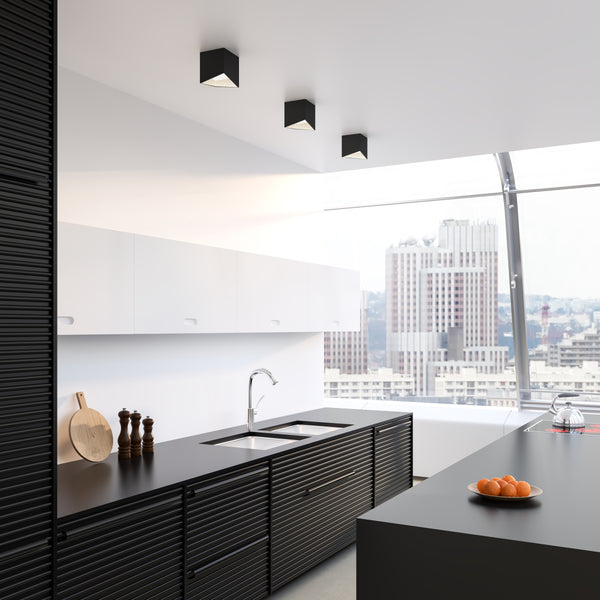 Cubix Ceiling Light by Kuzco - Black/White, Hanging on white canopy in kitchen